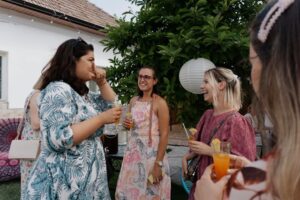 women standing and talking to each other