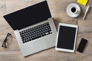 open laptop and tablet on a desk